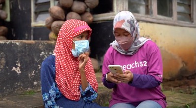 Caption: A reach52 Community Health Agent in Indonesia engages a resident using the reach52 offline-first mobile app. Photo credit: reach52 